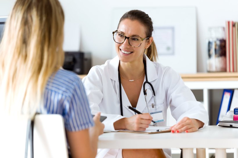 female doctor explaining diagnosis to female patient