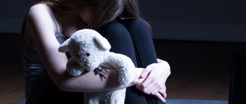 sad girl holding teddy bear, illustration of child neglect