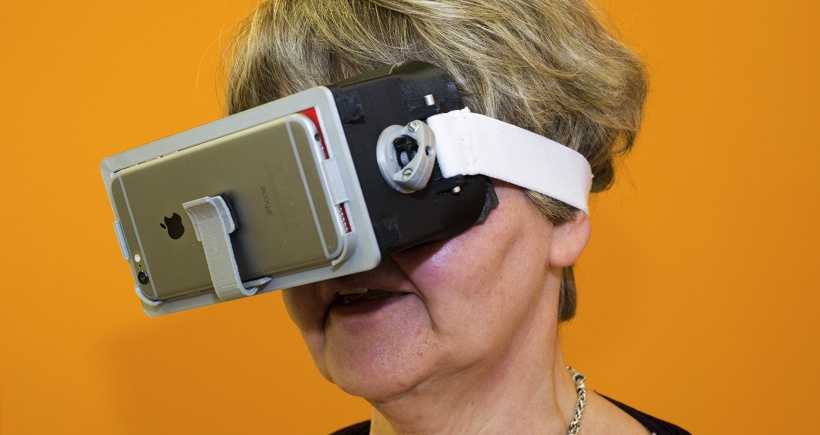 woman wearing a smartphone as a vision aid