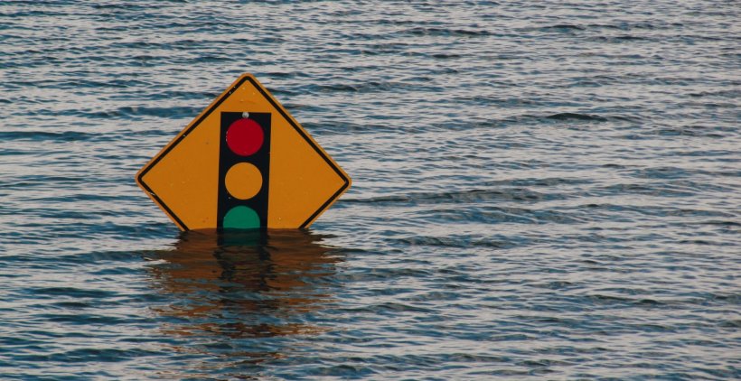 traffic lights roadsign partly covered with water from flooding