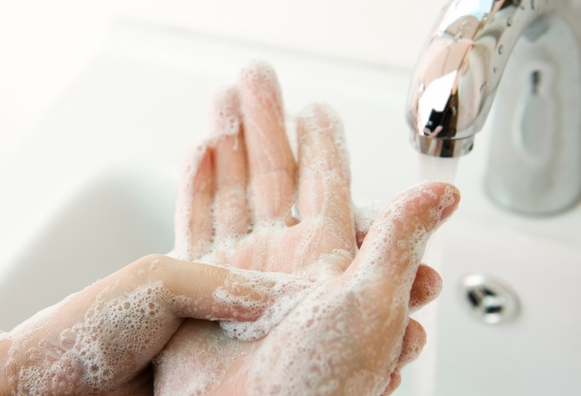 stock photo of person washing hands