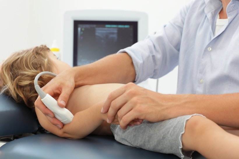 ultrasound examination of childs arm