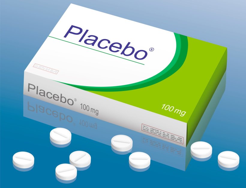 medicine package with Placebo label, scattered pills