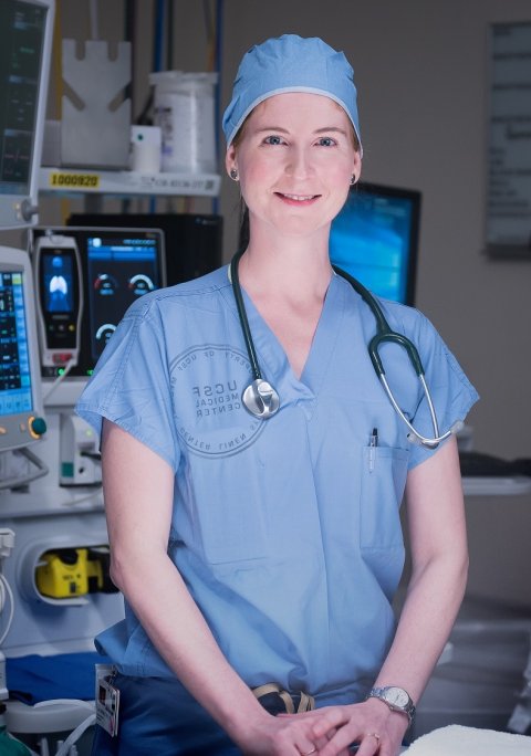 elisabeth whitlock standing in surgeon's gear in operating room