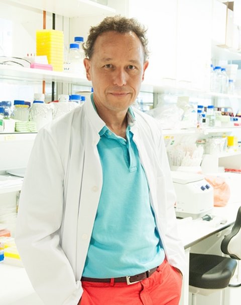 dr christian haass standing in a laboratory