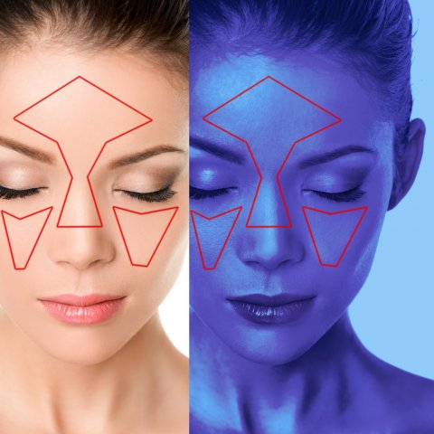 Face skin analysis on woman at beauty clinic with UV blue light