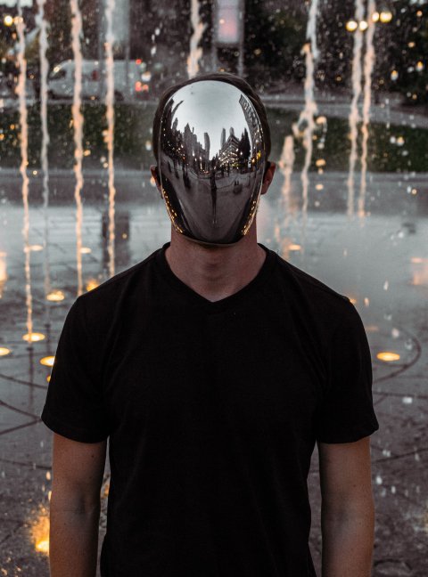 man wearing reflecting mirror mask