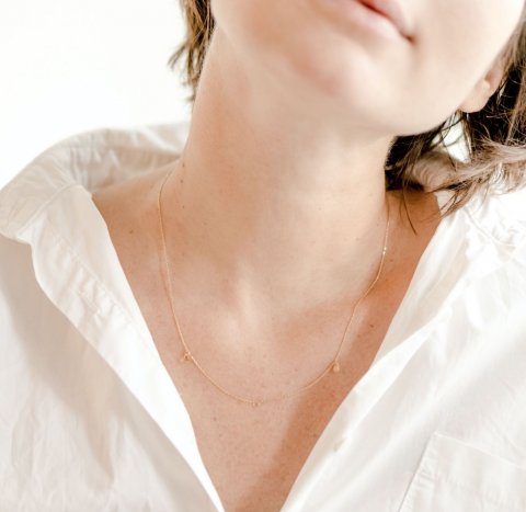 neck of woman in white shirt