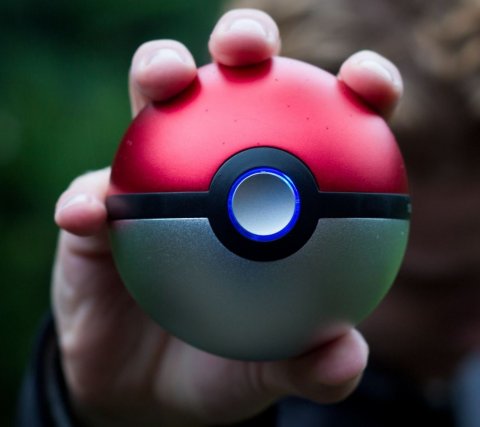 person holding pokeball