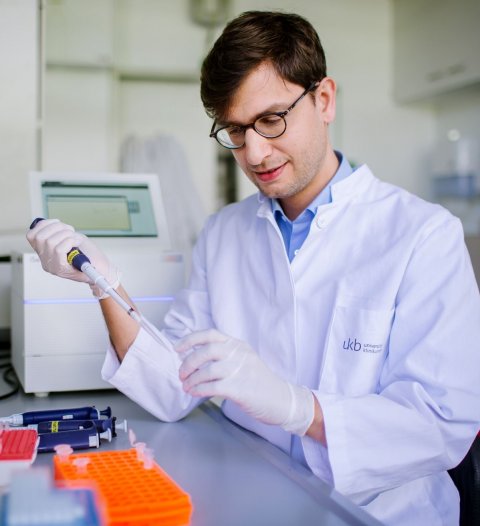 scientist in white coat working in a laboratory