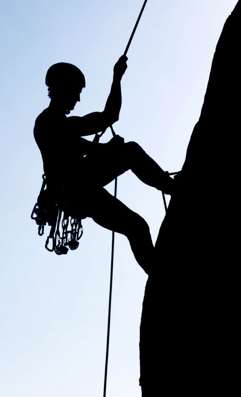 silhouette of mountain climber