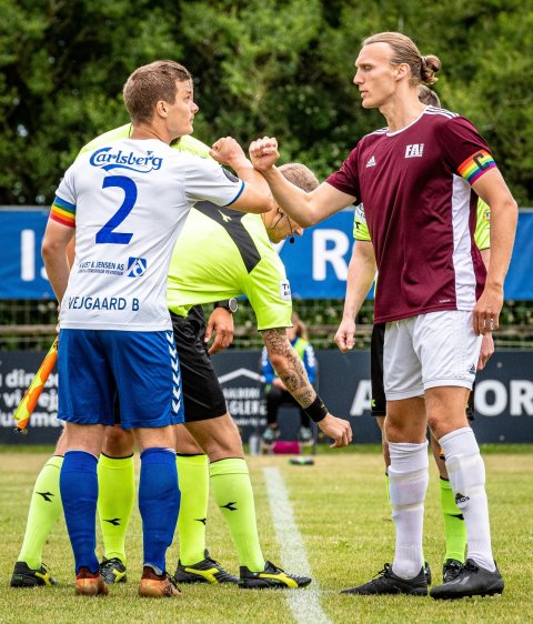 soccer players greeting before a match