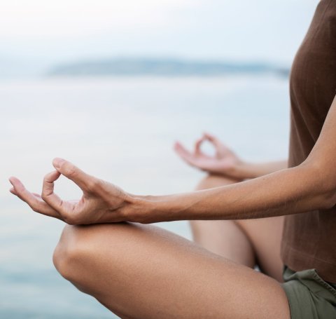 woman practicing relaxing yoga posture
