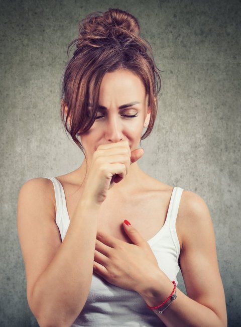 young woman coughing