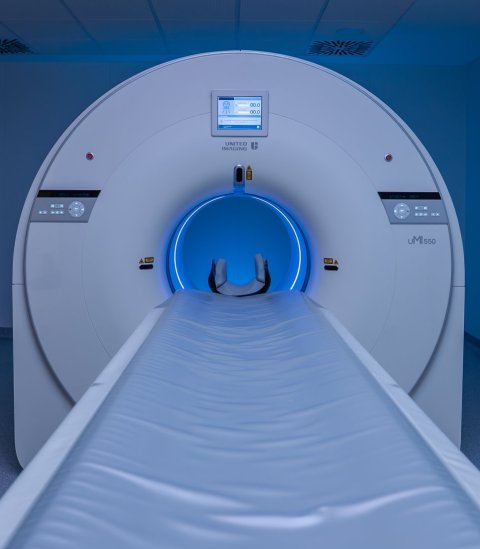 Frontal view of a PET/CT scanner in a hospital room