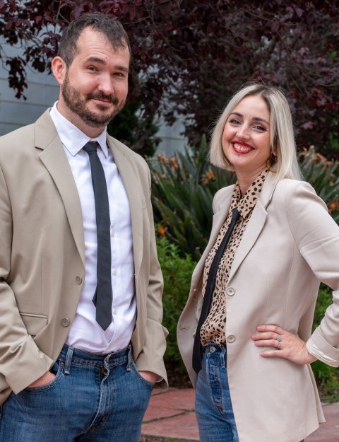 Maximilian Eggl and Silvia De Santis are standing outside at a research institute