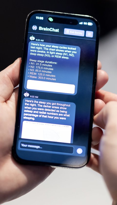 A smartphone is displaying a conversation with a chatbot