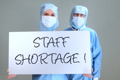 Two Doctors with shield staff shortage